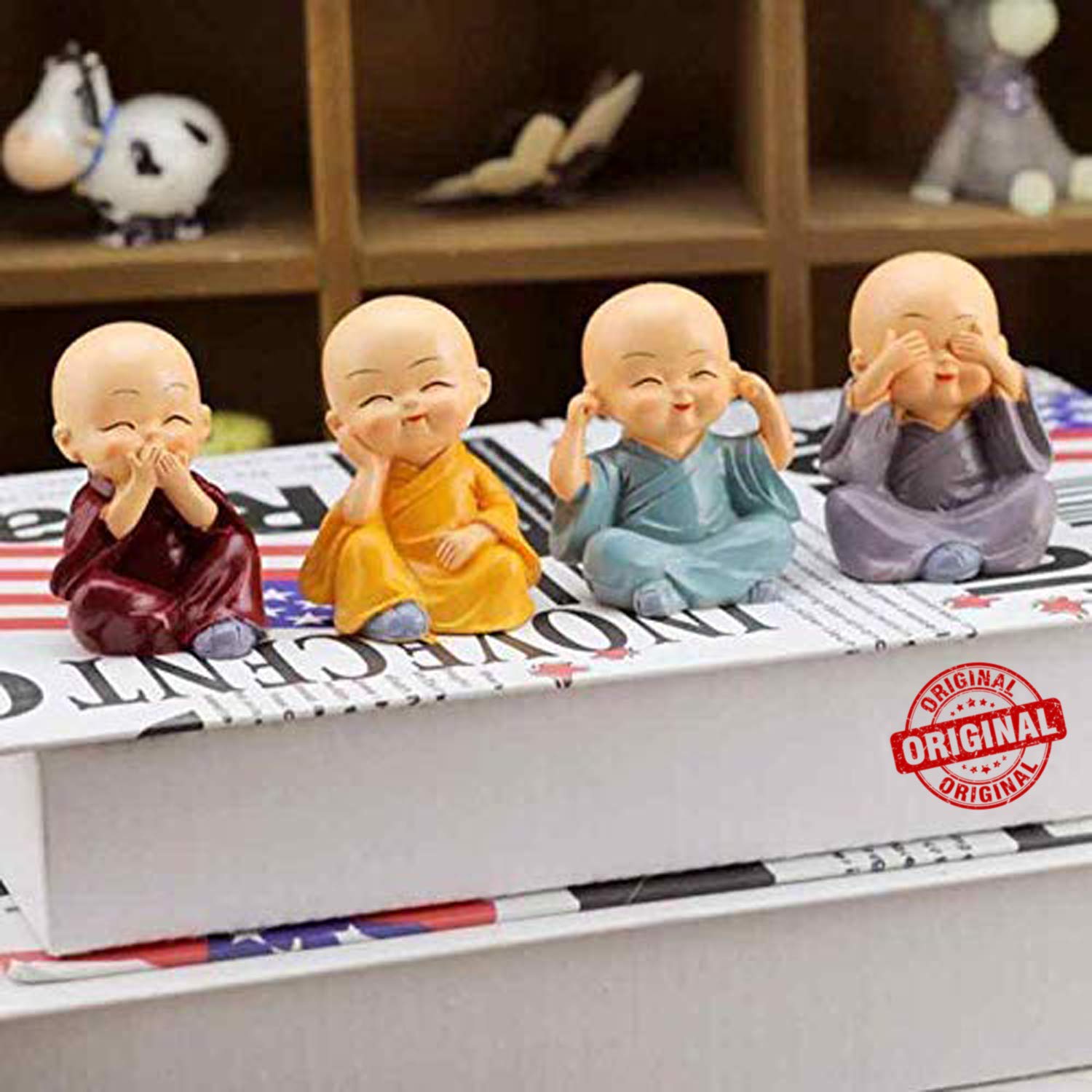 Set of Four Miniature Buddha Monk Statues