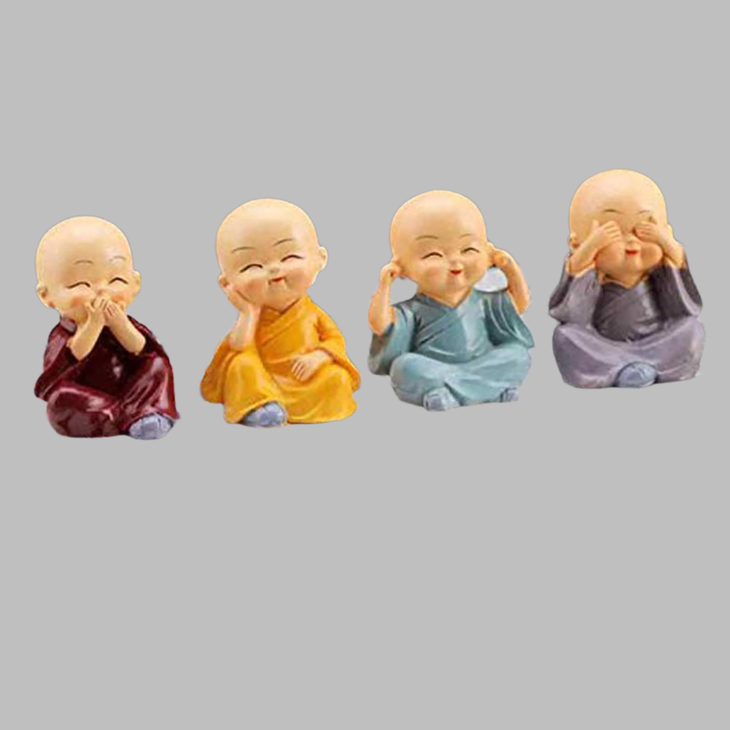 Set of Four Miniature Buddha Monk Statues